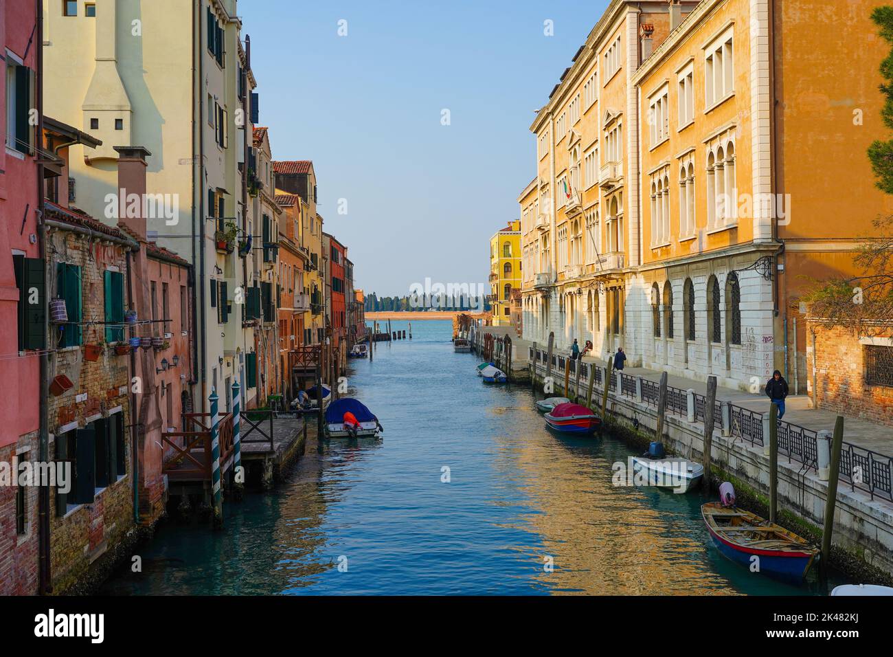 A traditional canal in Italy with moored boats Stock Photo