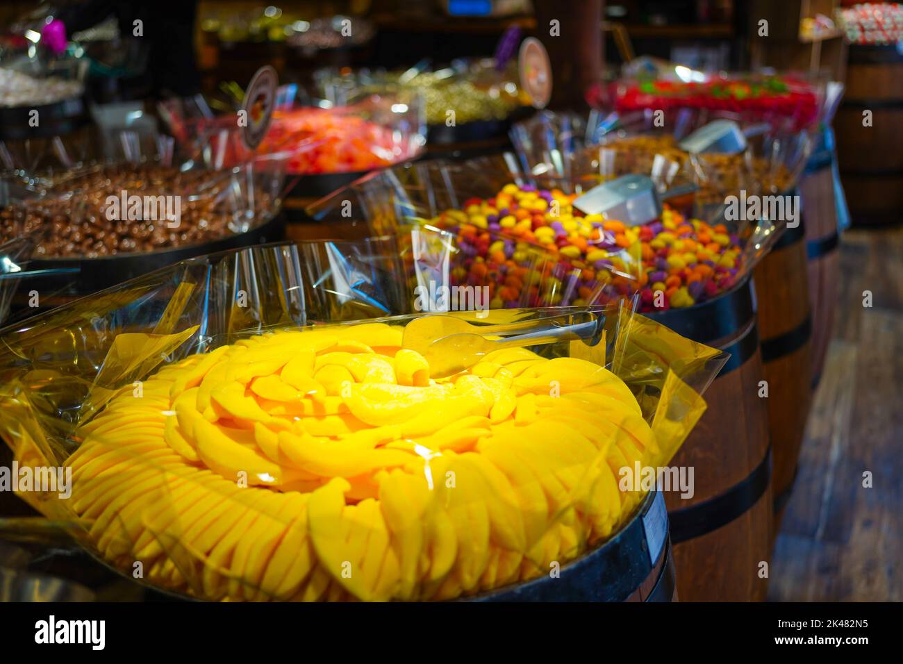 Colorful sweets in wooden barrels in a sweet shop Stock Photo