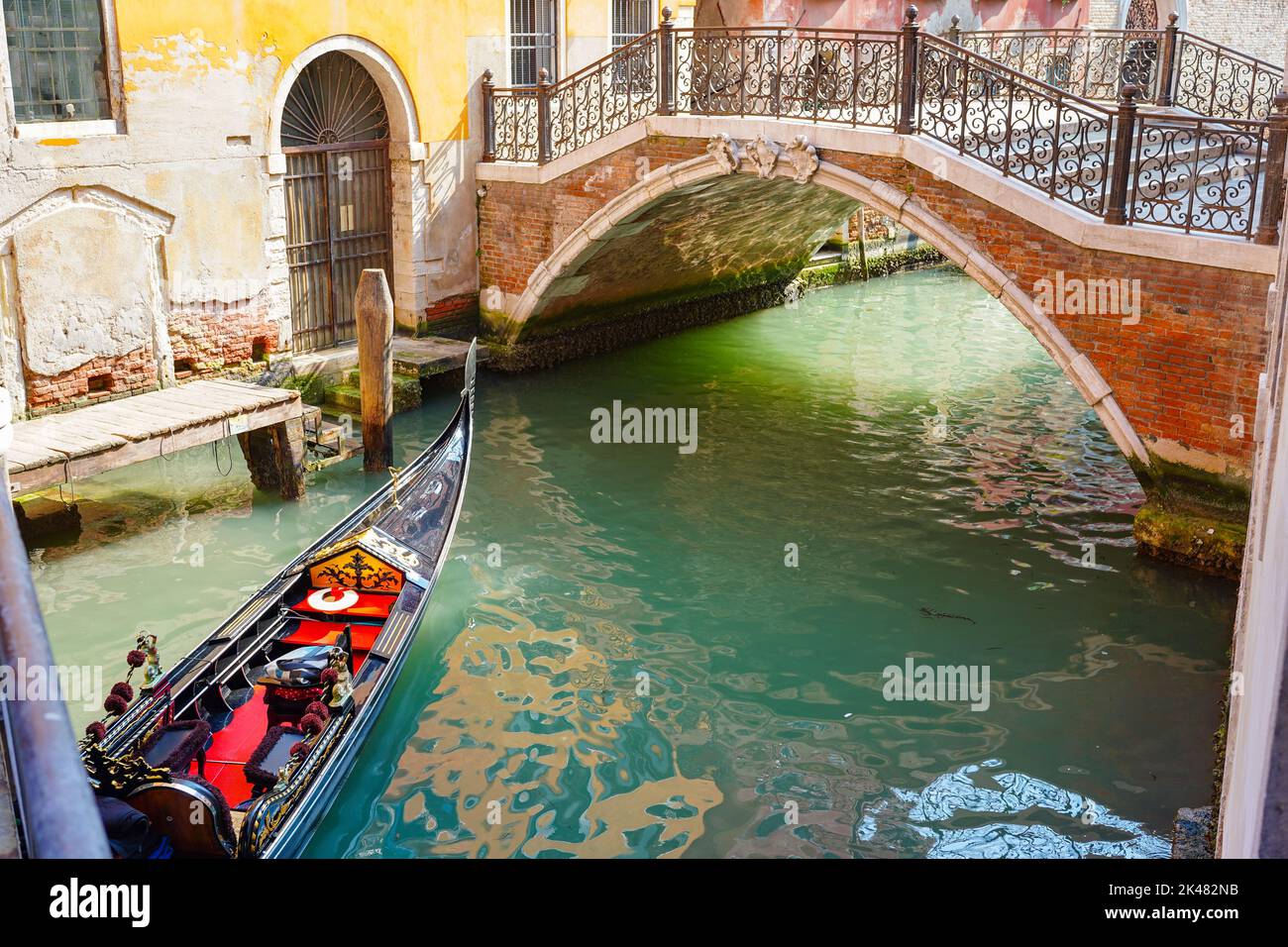 A traditional bridge over a canal in the city of Venice, Italy Stock Photo
