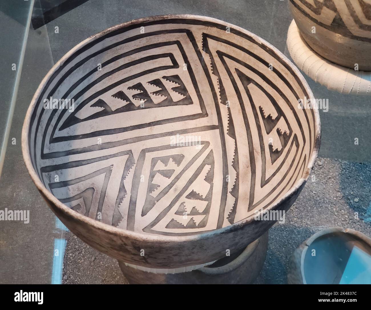 Ancient Native American Sosi white bowl with black geometric designs from Pueblo II on display at the Museum of Northern Arizona in Flagstaff, Arizona Stock Photo