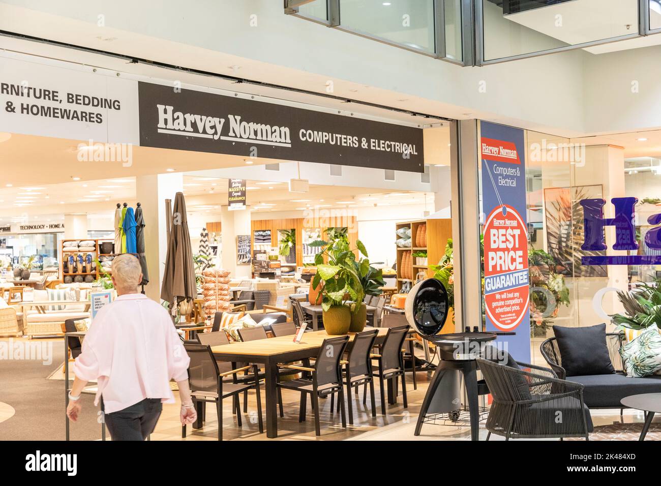 Harvey Norman Domanye store, woman model released enters the store in Belrose,Sydney,NSW,Australia Stock Photo