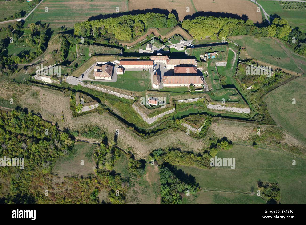 AERIAL VIEW. Historic military fortification on a hill with its star-shaped earthwork. Fort Barraux, Isère, Auvergne-Rhône-Alpes, France. Stock Photo