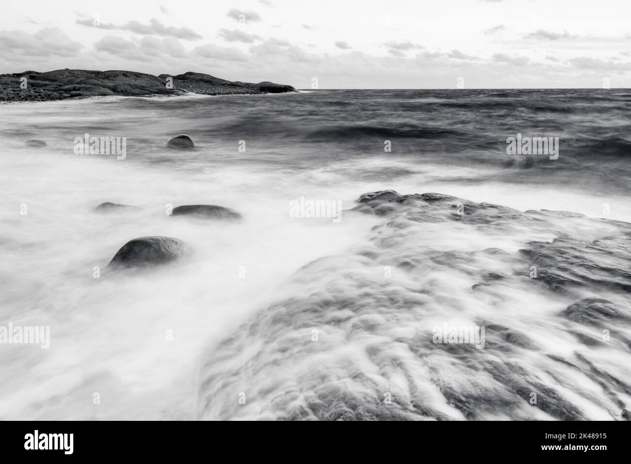 Seascape with waves crashing on the coastline Stock Photo