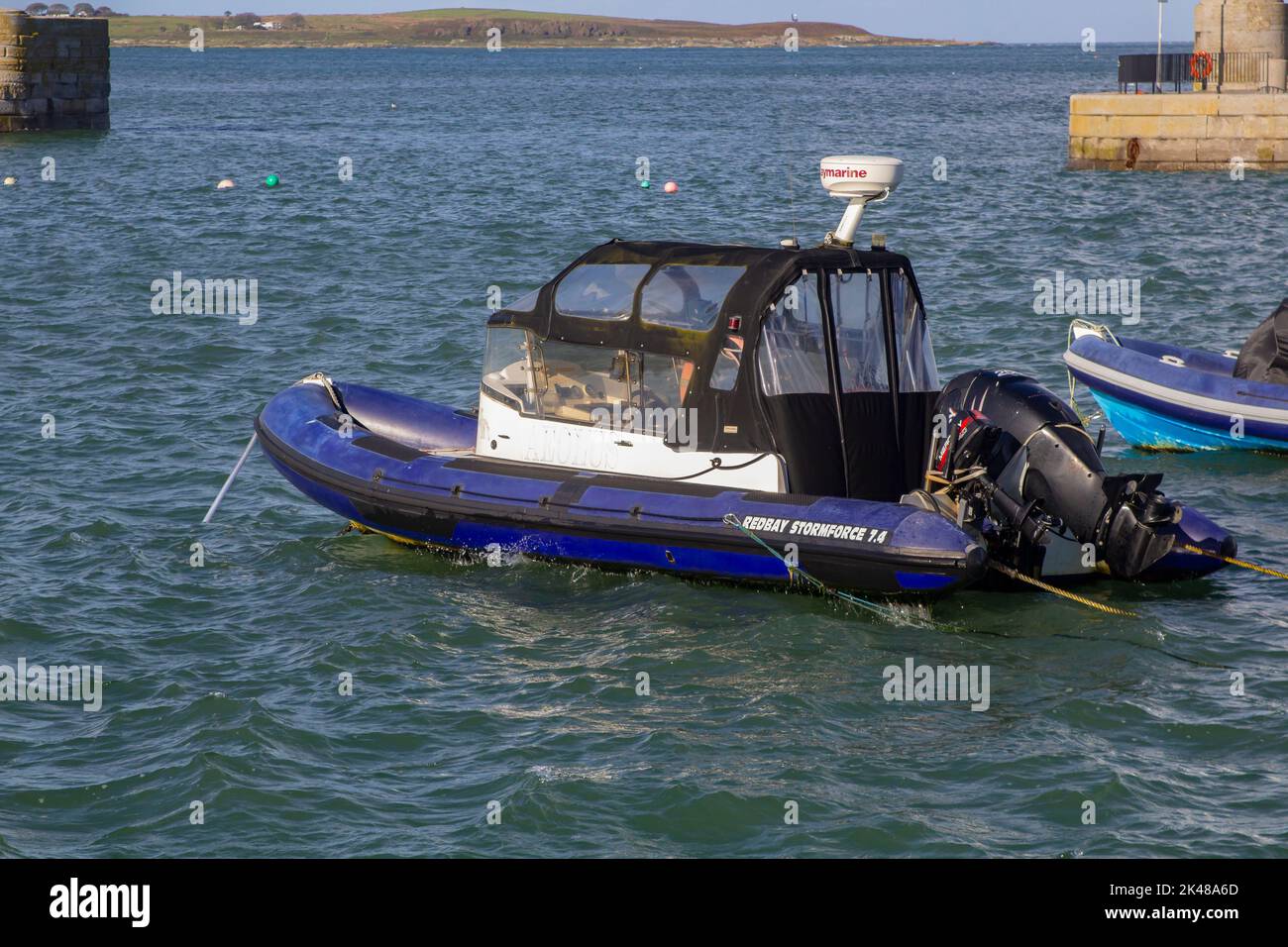 30 September 2022 A Redray Stormforce 7.4 Rib moored in Donaghadee Harbour, Northern Ireland in the soft sunlight of early autumn. Stock Photo