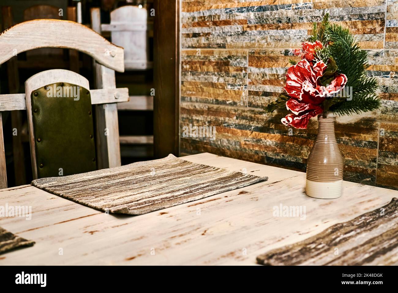 A table in a cafe ready for serving with a New Year's Christmas bouquet Stock Photo
