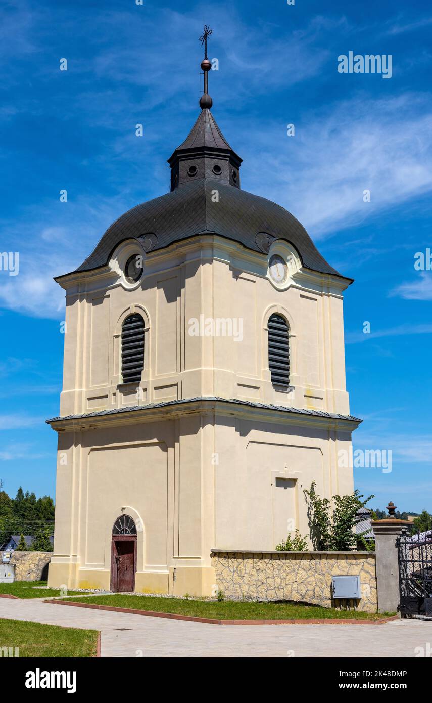 Pilica, Poland - July 25, 2022: Bell tower aside St. John Baptist parish church, kosciol Sw. Jana Chrzciciela, in historic old town quarter of Pilica Stock Photo