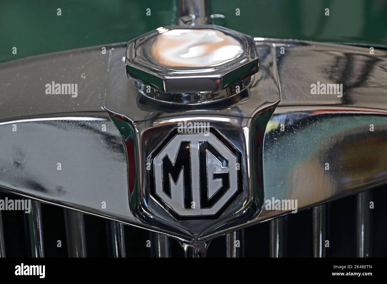 MG car badge on top of radiator grille Stock Photo