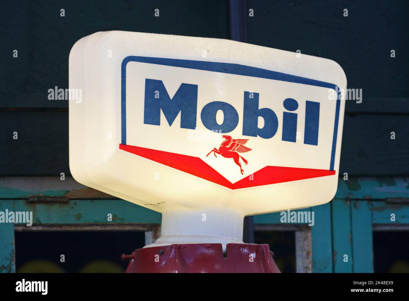 Illuminated, old, Mobil petrol pump sign Stock Photo
