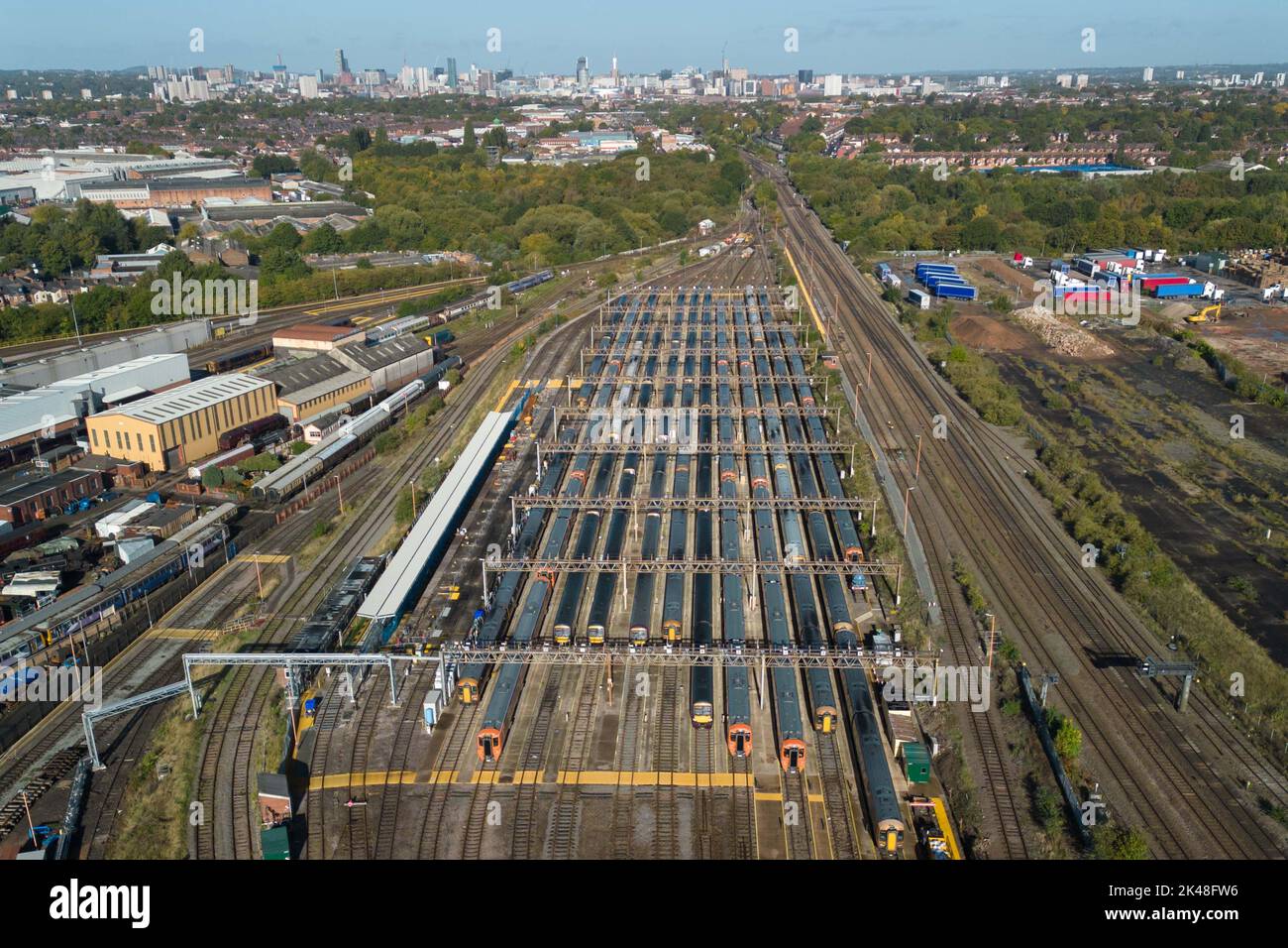 Tyseley, Birmingham, UK. October 1st 2022 - Unused and parked West Midlands Railway trains at the Tyseley train maintenance depot with the Birmingham skyline in the distance as rail workers take part in continued strike action. Pic by Credit: Scott CM/Alamy Live News Stock Photo