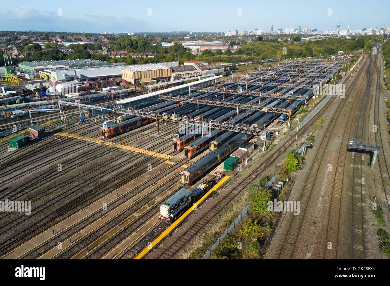 Tyseley, Birmingham, UK. October 1st 2022 - Unused and parked West Midlands Railway trains at the Tyseley train maintenance depot with the Birmingham skyline in the distance as rail workers take part in continued strike action. Pic by Credit: Scott CM/Alamy Live News Stock Photo