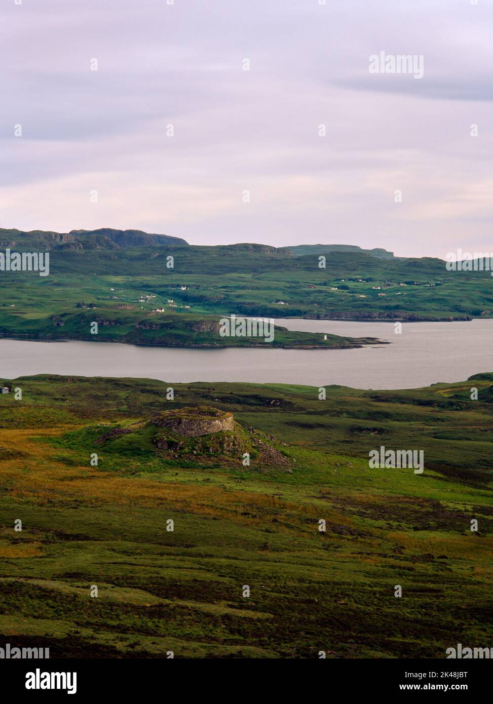 Dun Beag Iron Age broch, Struanmore, Isle of Skye, Scotland, UK, looking SW from Dun Mor over Lochs Harport & Bracadale to Ardtreck Point lighthouse. Stock Photo