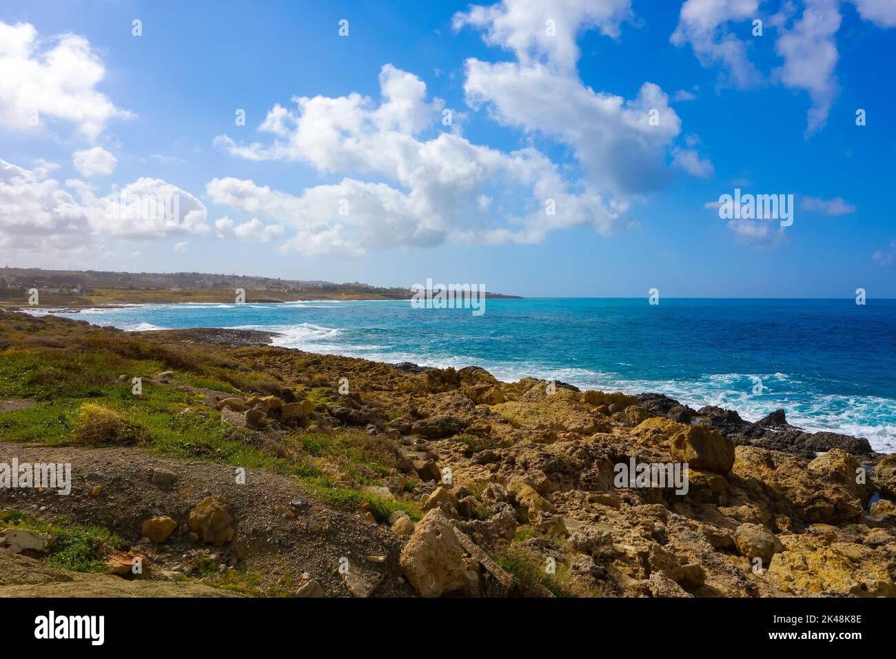 Beautiful landscape with a sea, coast, stones and cloudy sky. Stock Photo