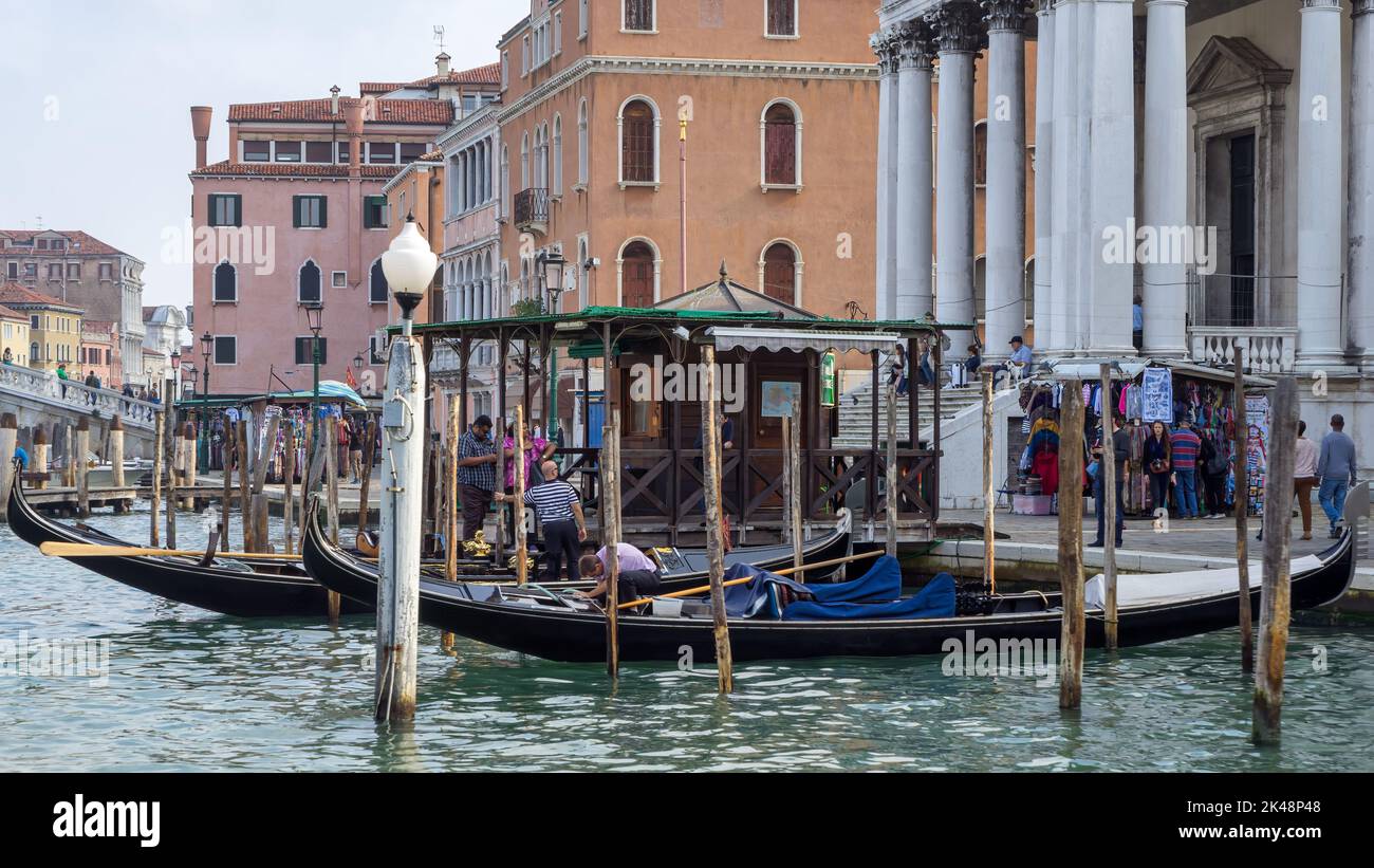 VENICE, ITALY - OCTOBER 12 : Gondolas available for hire in Venice on October 12, 2014. Unidentified people. Stock Photo