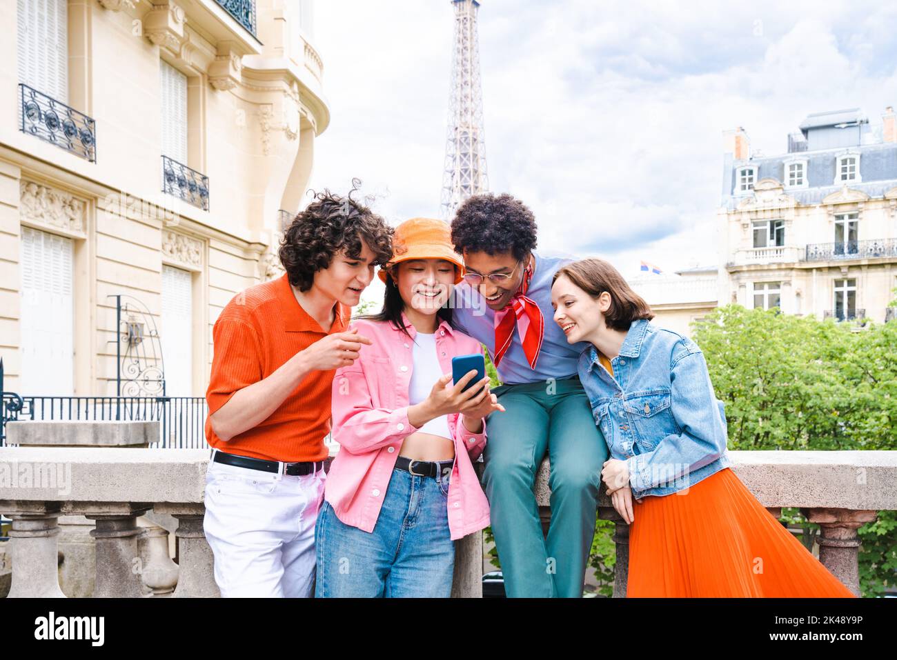 Group of young happy friends visiting Paris and Eiffel Tower, Trocadero ...