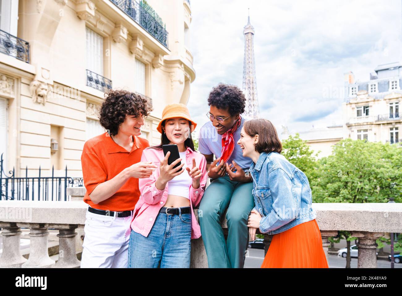 Group of young happy friends visiting Paris and Eiffel Tower, Trocadero ...