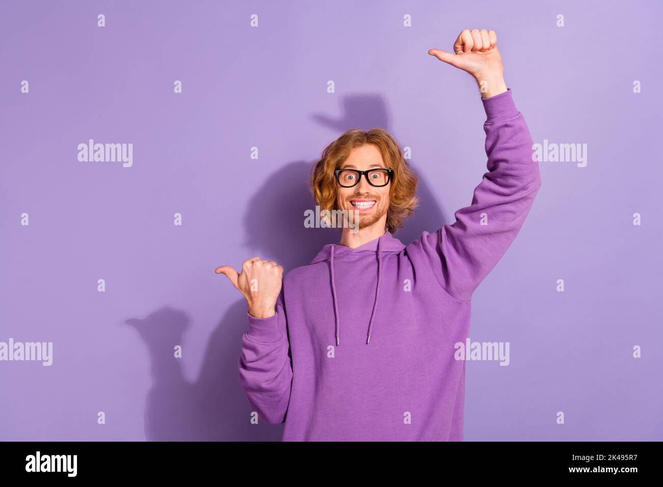 Photo of impressed curly red hairstyle guy index promo wear eyewear