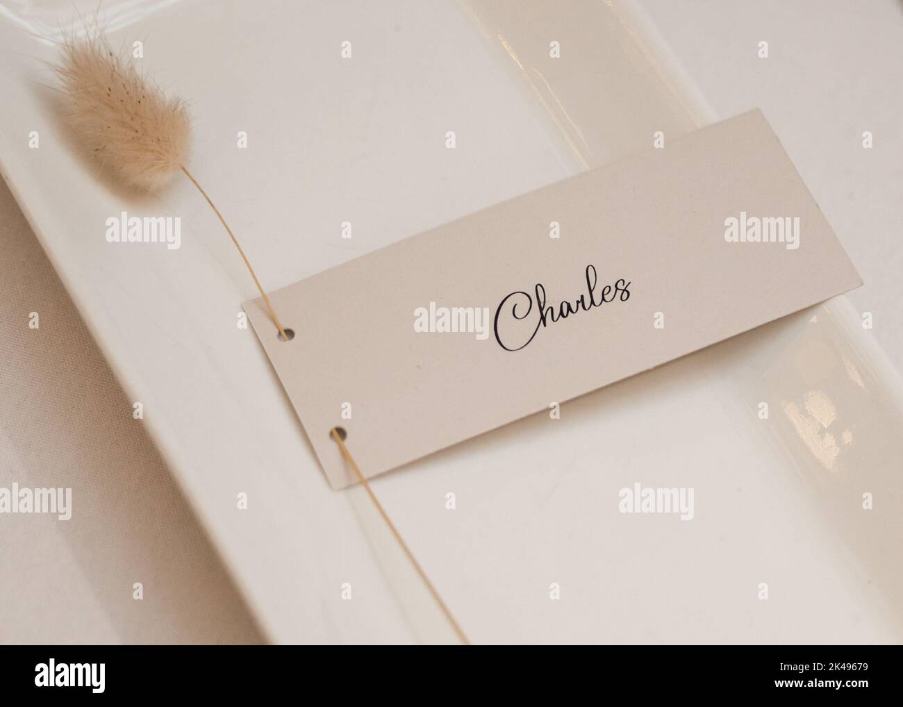 Charles name plate beautiful setting on table with scripted text Stock Photo