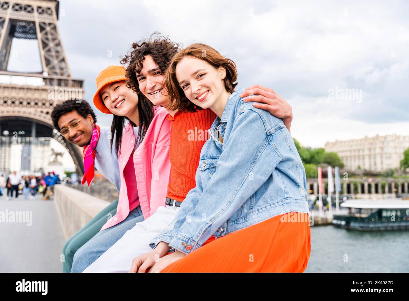 Group Of Young Happy Friends Visiting Paris And Eiffel Tower, Trocadero 