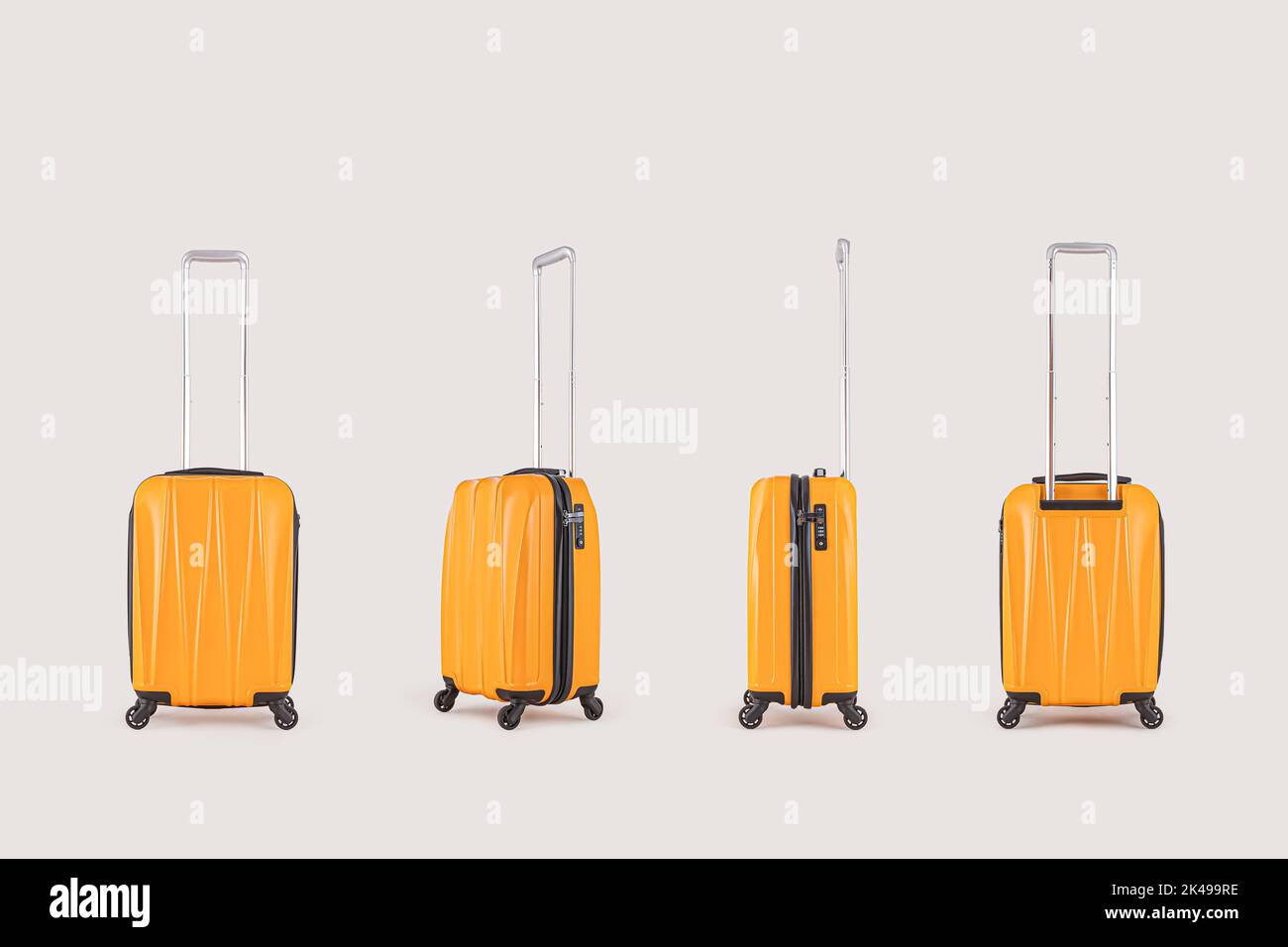 Set up of stylish yellow suitcases isolated on white background Stock Photo