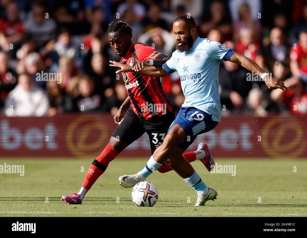 Bournemouth's Jordan Zemura (left) and Brentford's Bryan Mbeumo battle for the ball during the Premier League match at the Vitality Stadium, Bournemouth. Picture date: Saturday October 1, 2022. Stock Photo