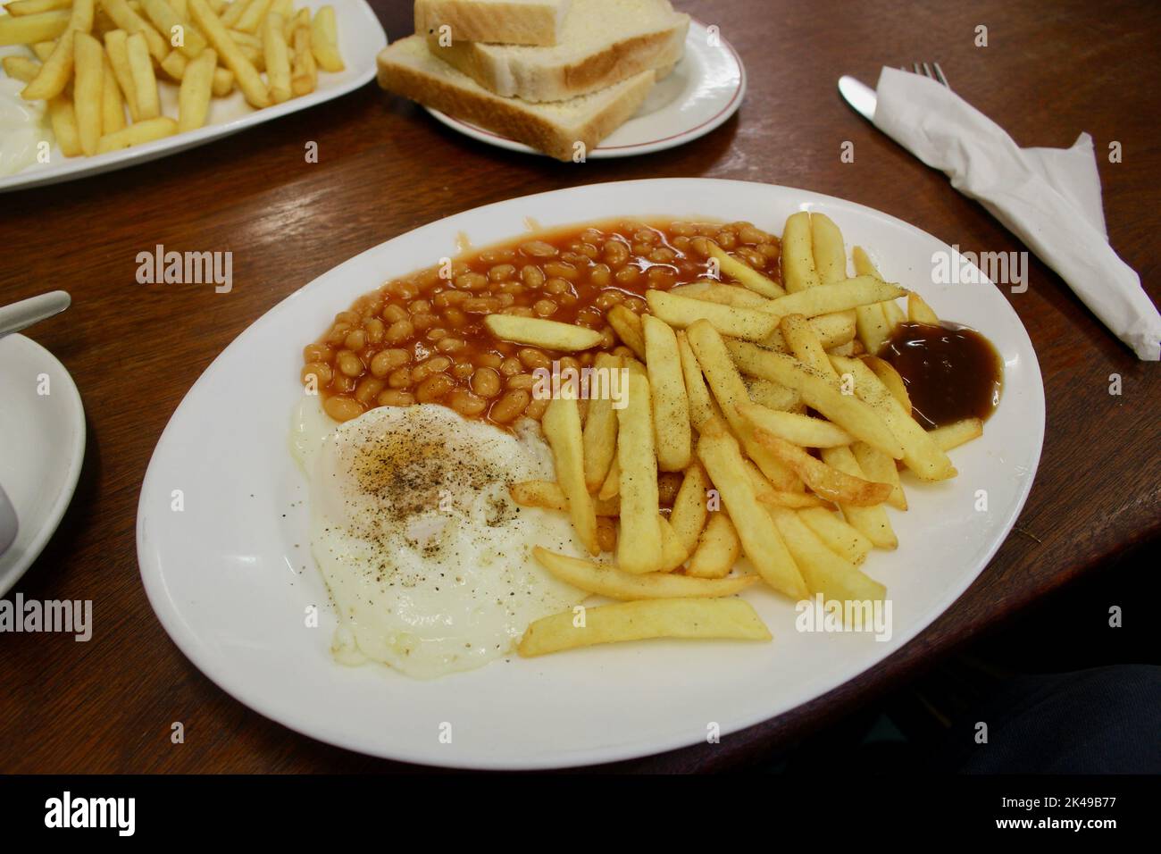 egg chips beans two slices and a cup of tea at the hope cafe on holloway road london england UK