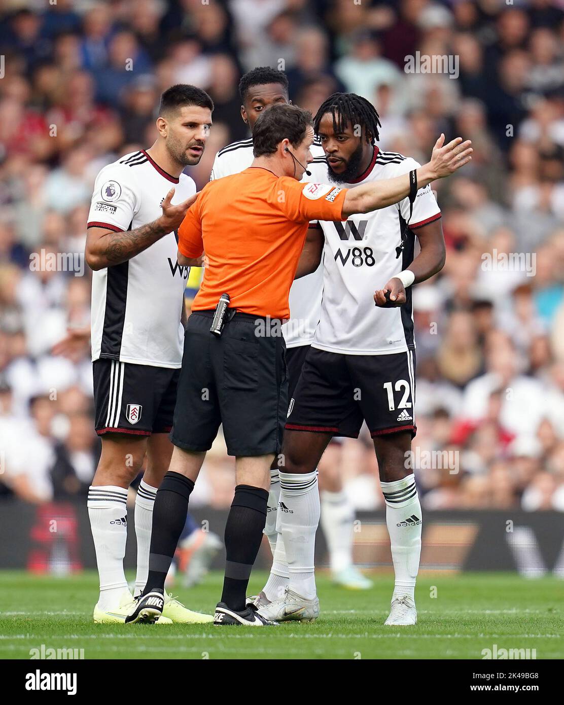 Referee Darren England shows a red card to Fulham’s Nathaniel Chalobah