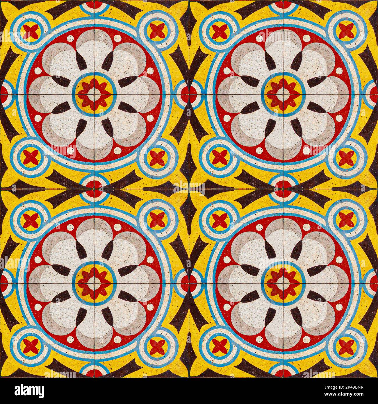 Photograph of traditional vietnam tiles in red, black, blue and yellow
