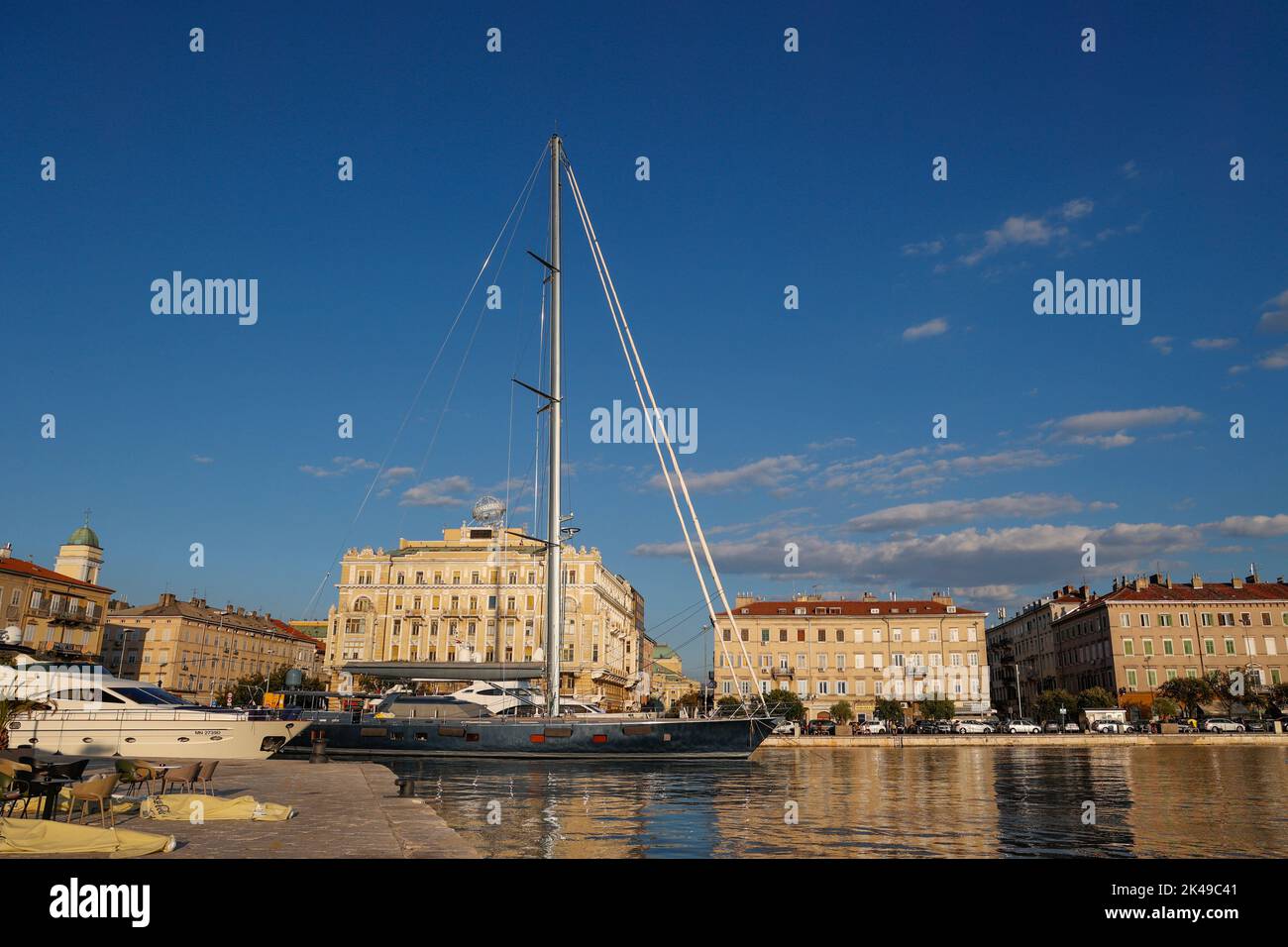 View of yachts anchored in the harbour with Palazzo Bacich,  today the Transadria building, in the background, Rijeka,Istria,Croatia Stock Photo