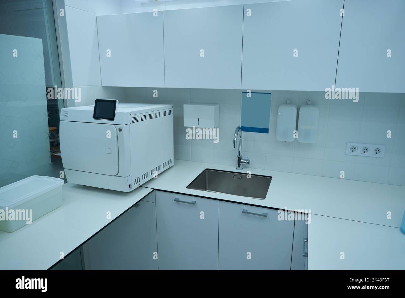 Dental office with sink and instrument sterilization equipment Stock Photo Alamy