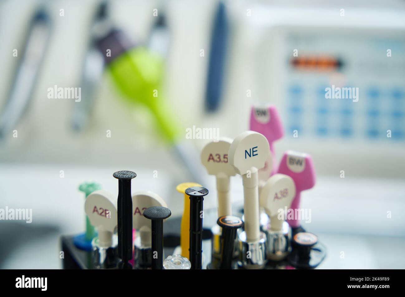 Dental syringes with drug numbers against background of dental chair