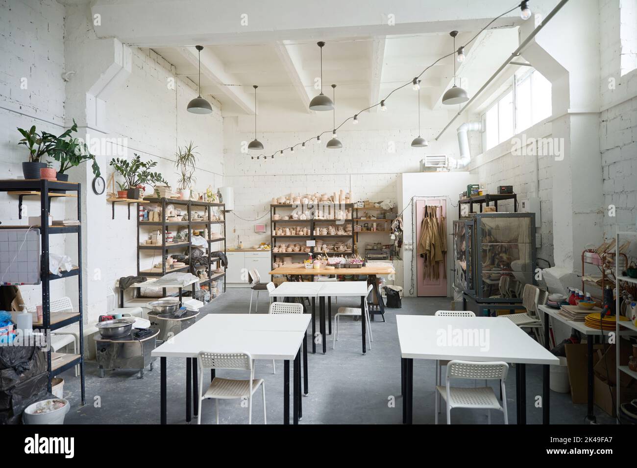 Modern pottery with shelving and tables Stock Photo Alamy