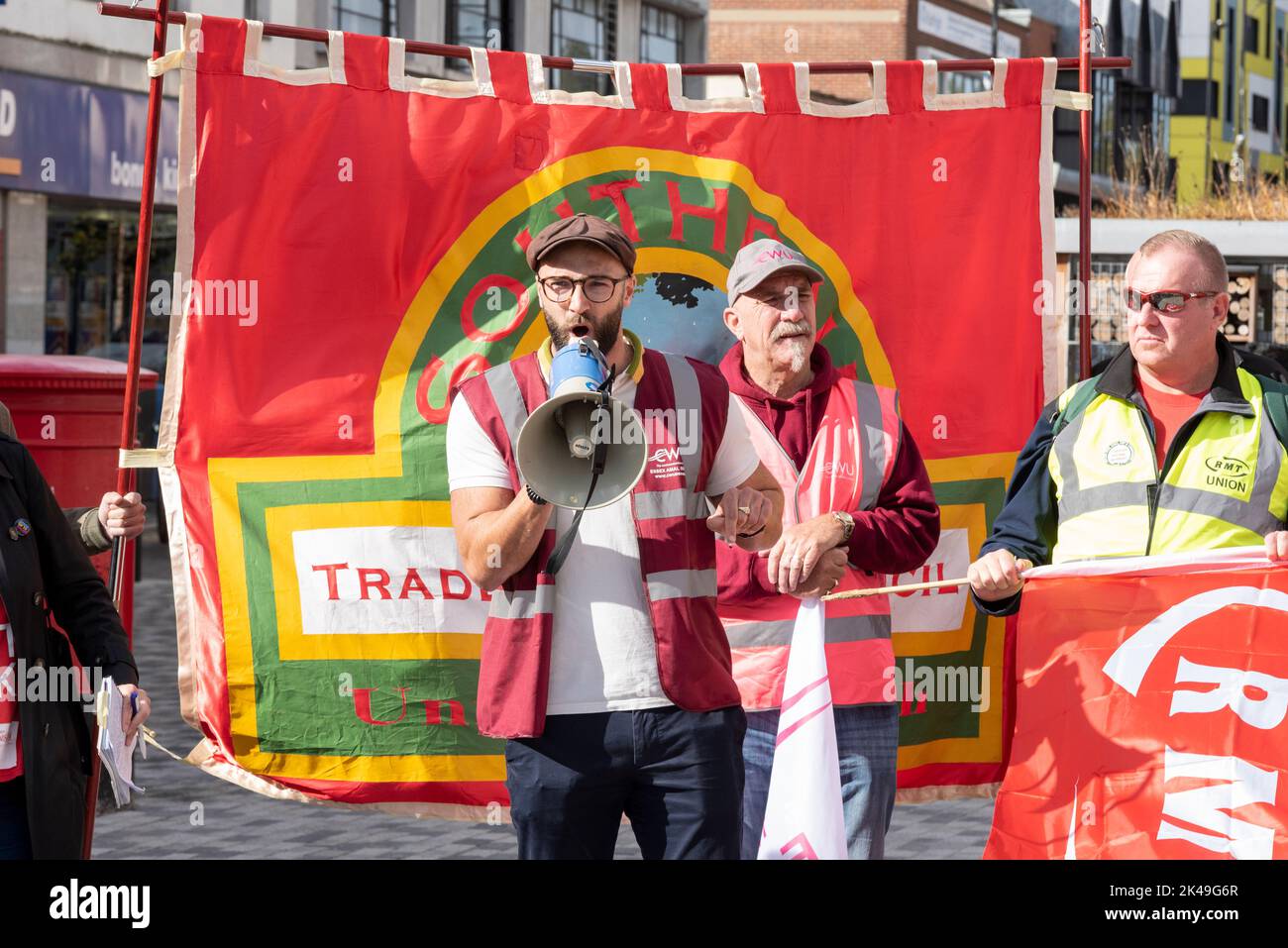 Luke Elgar of the CWU speaking at a Enough is Enough protest against the cost of living crisis & demanding real pay rises. With RMT member Stock Photo