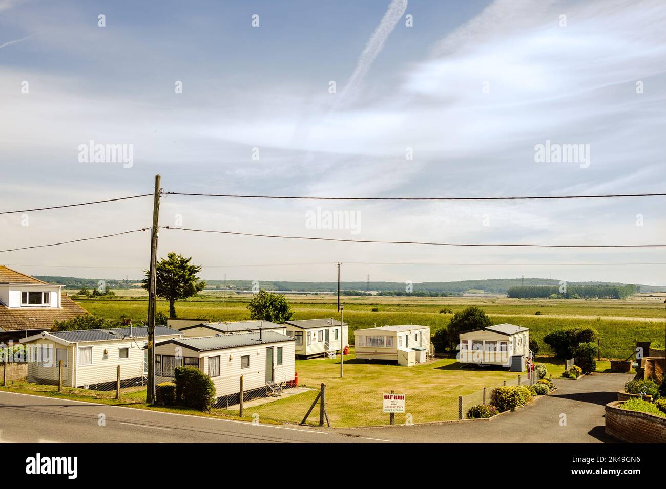 A compact caravan park opposite the beach to the west of Seasalter Stock Photo