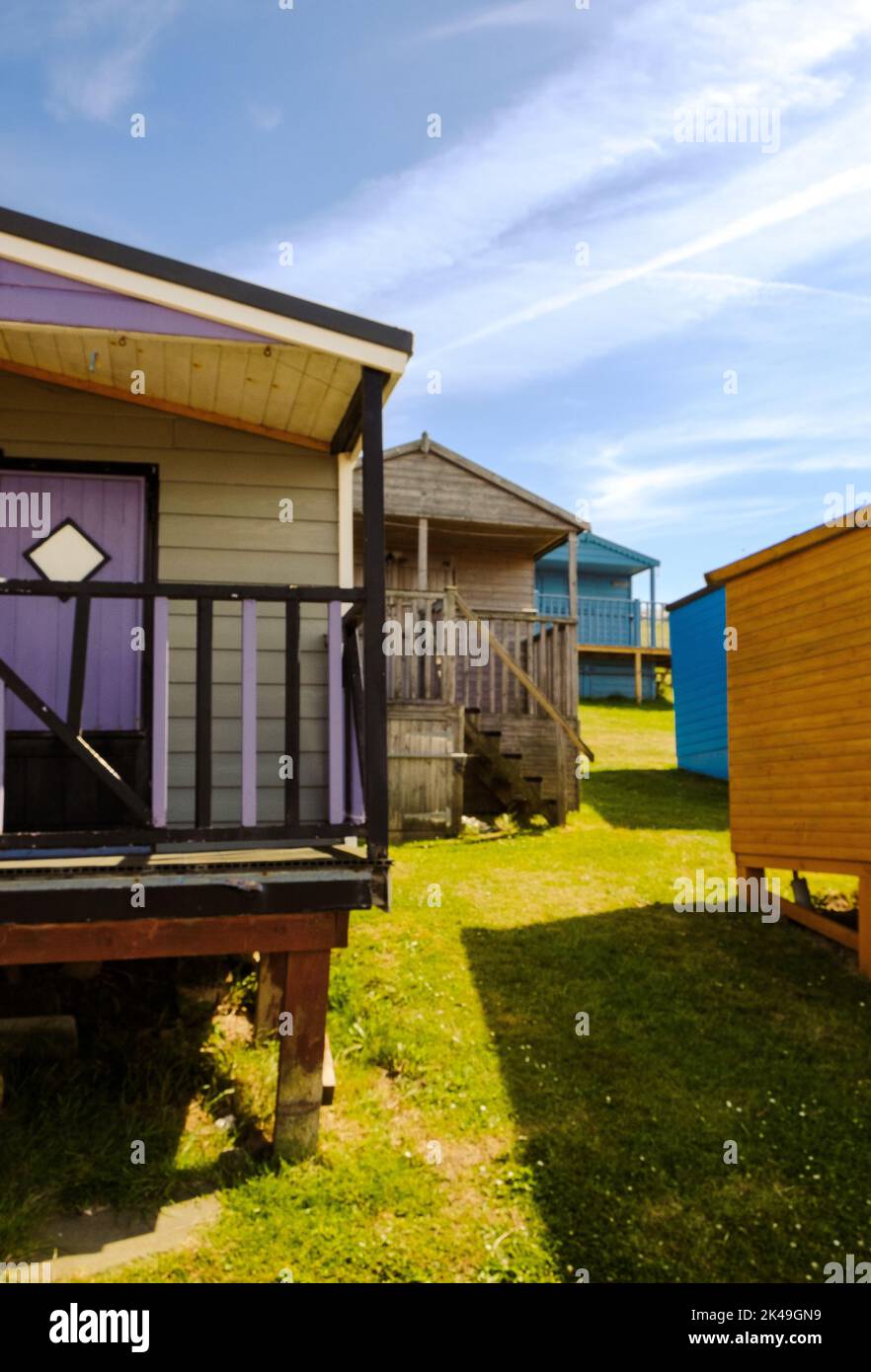 Layers of beach huts at Tankerton, just east of Whitstable, Kent Stock Photo