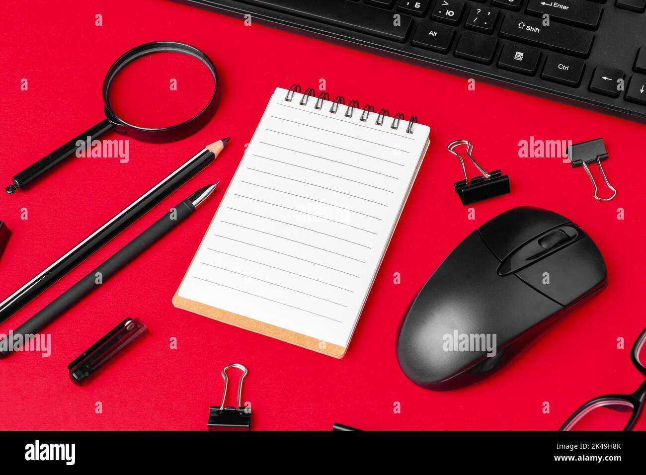 Set of stationery items on red office desk Stock Photo Alamy