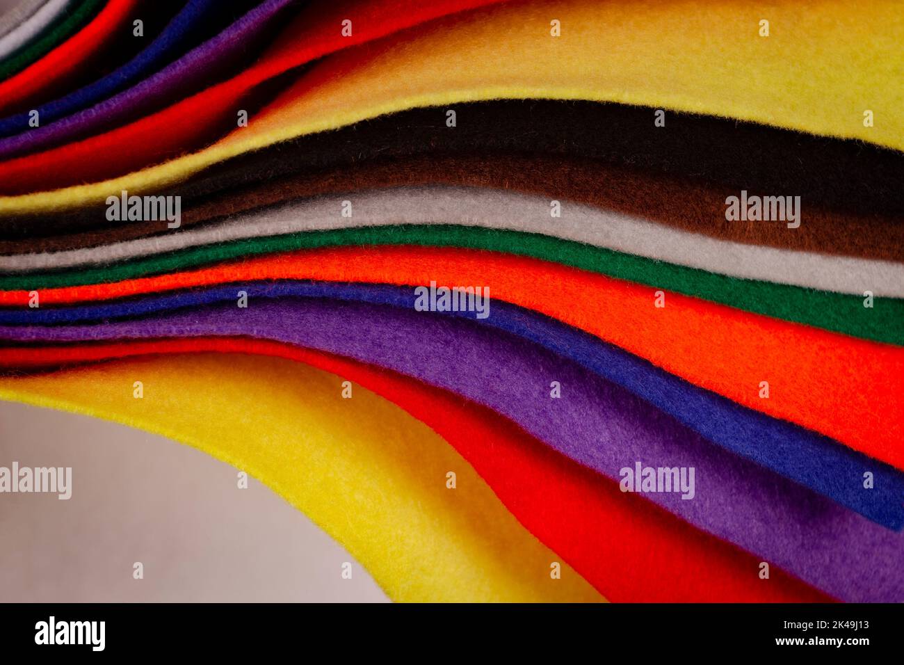Several colored felt texture background. Assorted color felt fabric sheets, patchwork, sewing DIY craft Stock Photo