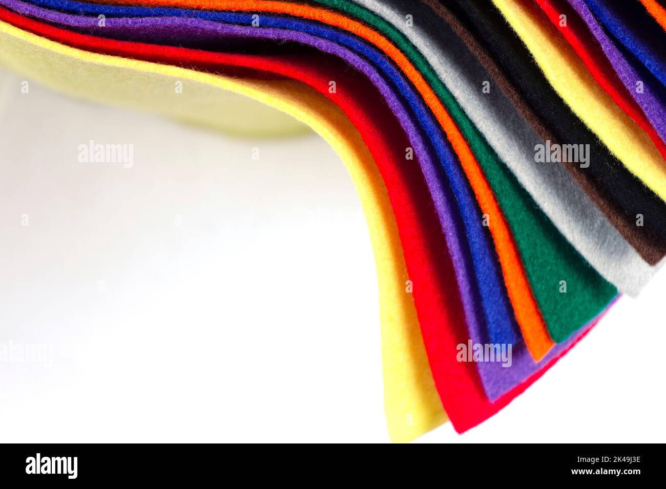 Several colored felt texture background. Assorted color felt fabric sheets, patchwork, sewing DIY craft Stock Photo