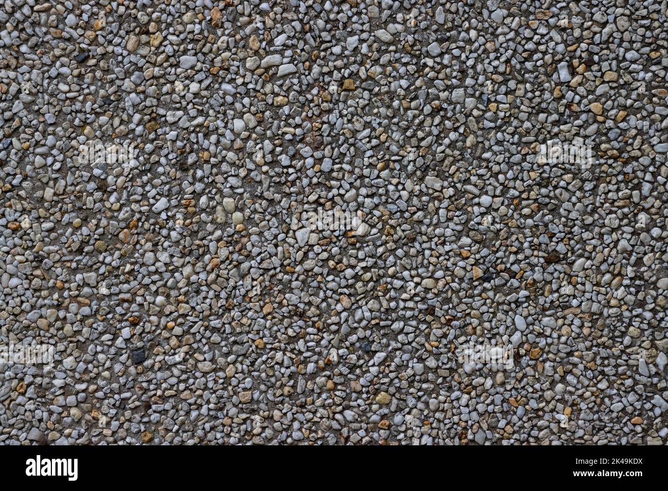 Small pebbles in concrete wall for background Stock Photo Alamy