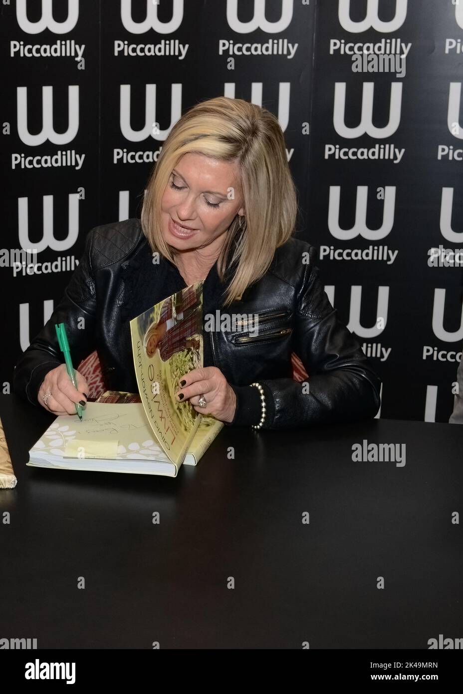 London, UK - April 19, 2012: Olivia Newton-John signs copies of her book 'LivWise: Easy Recipes for a Healthy Happy Life' at Waterstones Piccadilly in Stock Photo