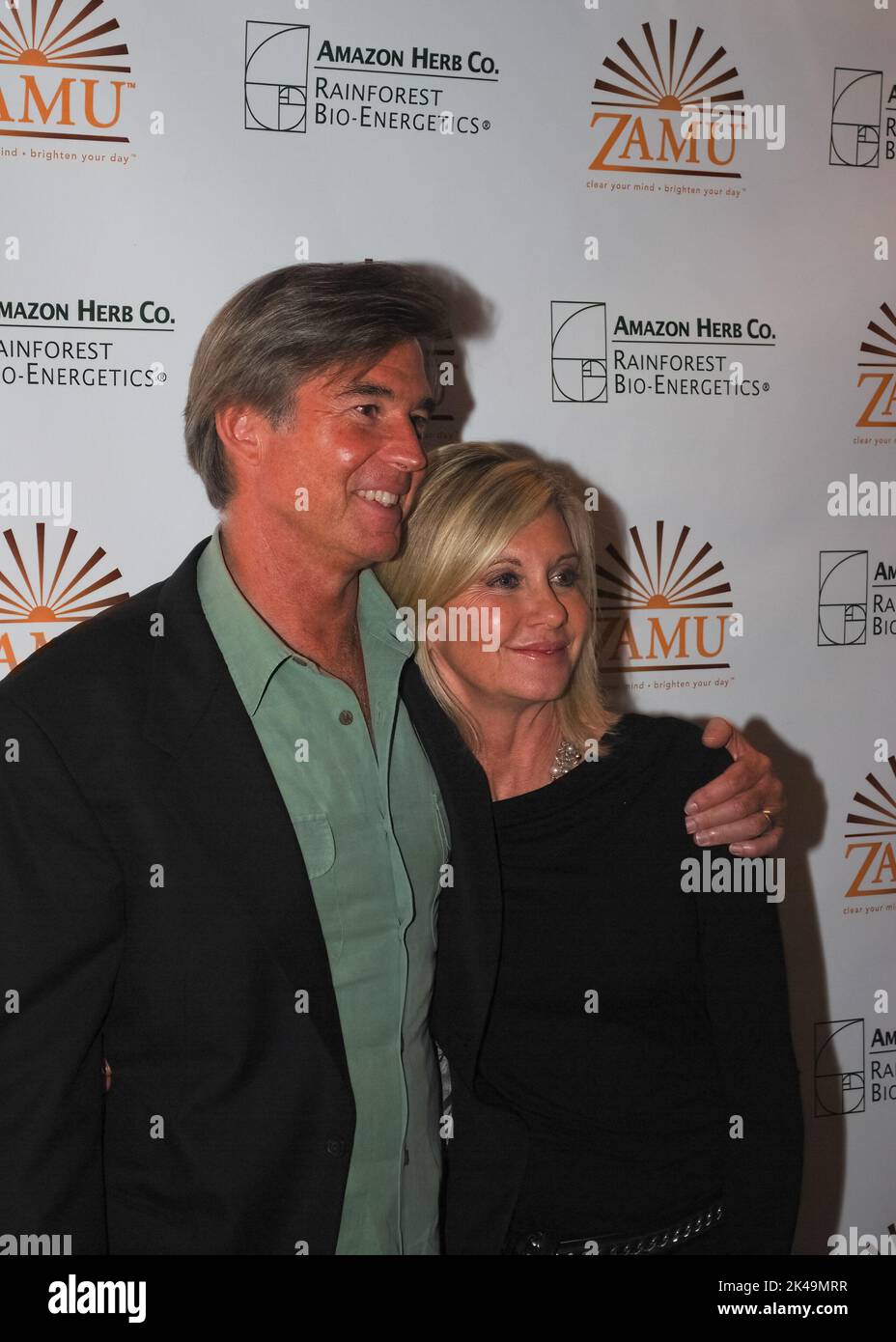 Olivia Newton-John and her husband John Easterling visit a Amazon Herb showcase for the Zamu health drink in Cologne on October 6, 2009 Stock Photo