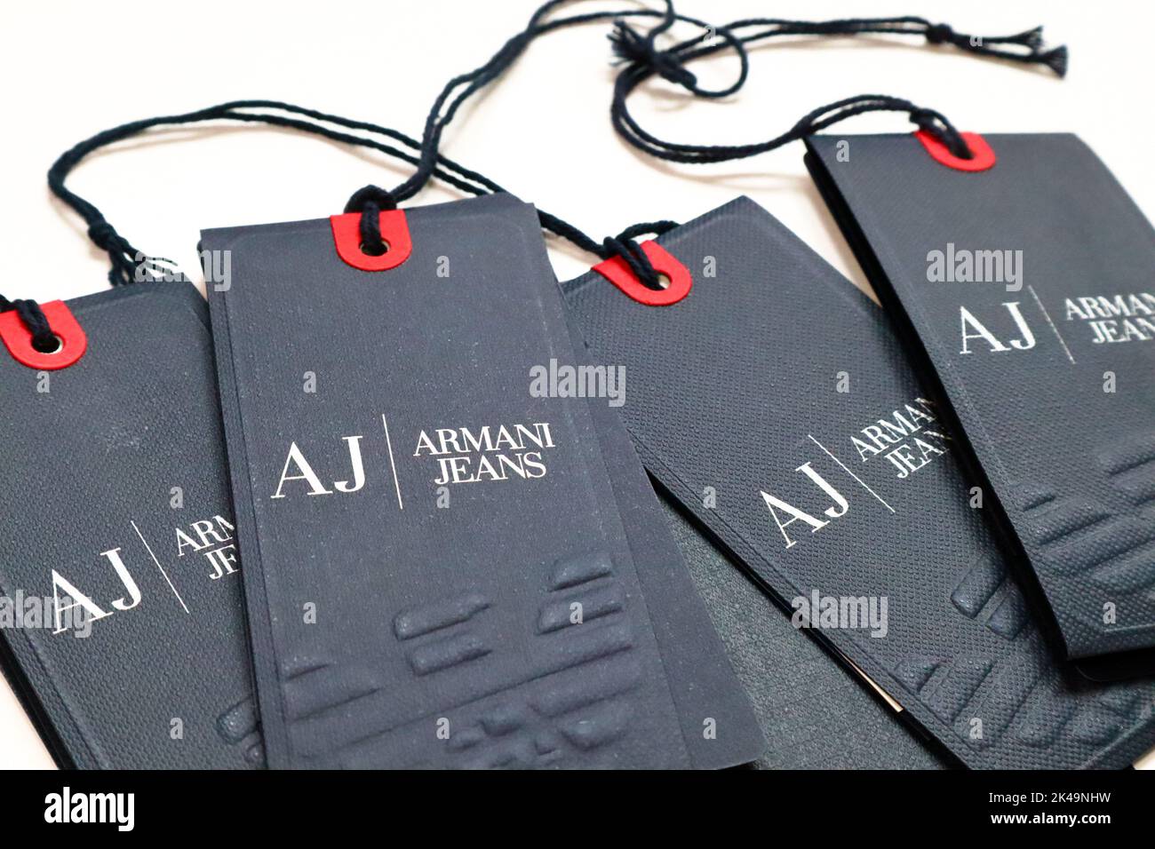 Tags of AJ ARMANI JEANS clothing. AJ is an Italian luxury fashion