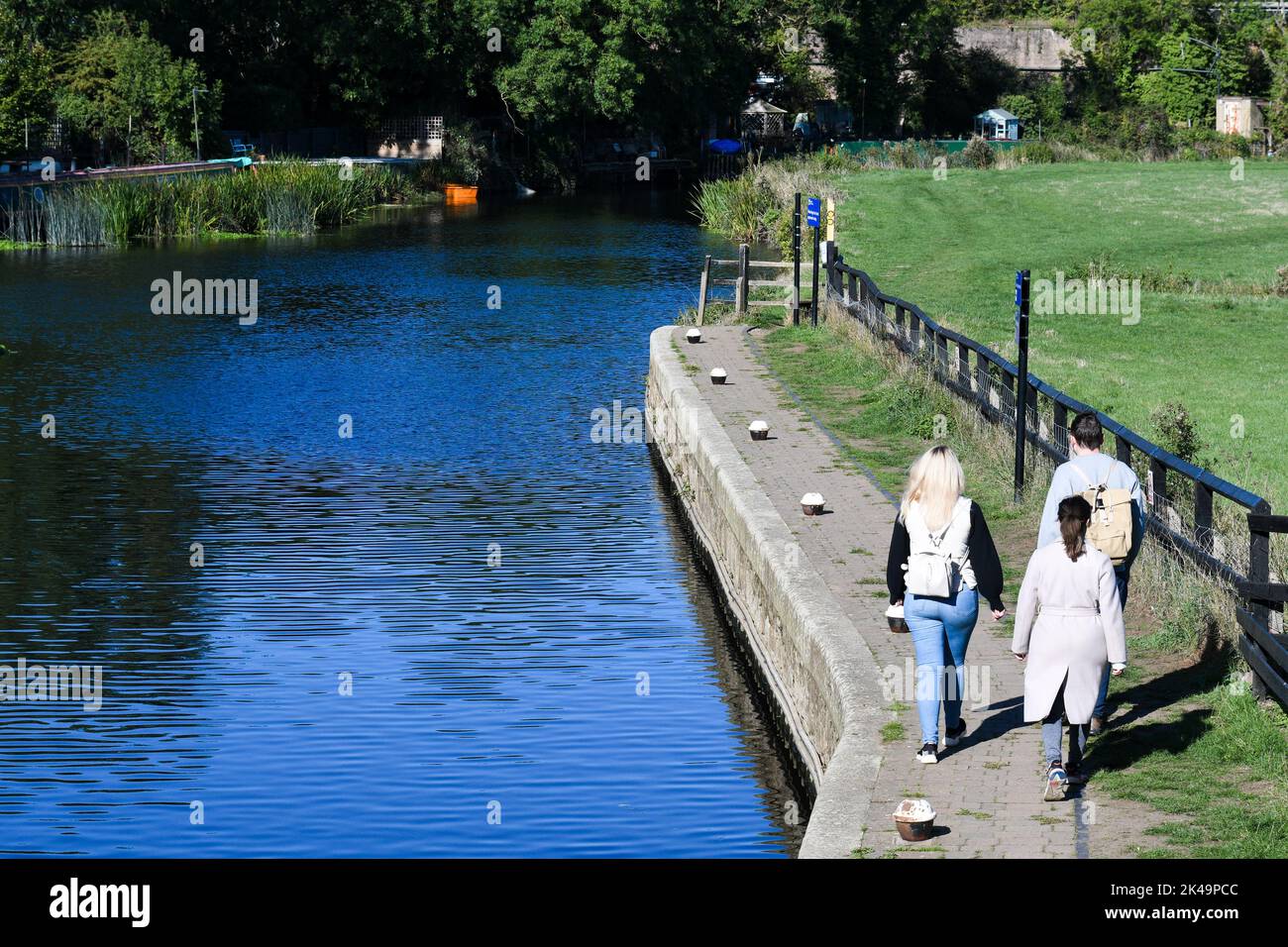three people walking along the river soar in leicestershire Stock Photo