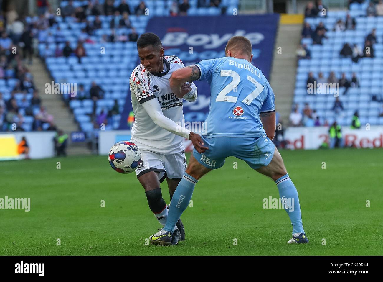 Isaiah Jones #2 of Middlesbrough is tackled by Jake Bidwell #27 of Coventry City during the Sky Bet Championship match Coventry City vs Middlesbrough at Coventry Building Society Arena, Coventry, United Kingdom, 1st October 2022  (Photo by Gareth Evans/News Images) Stock Photo