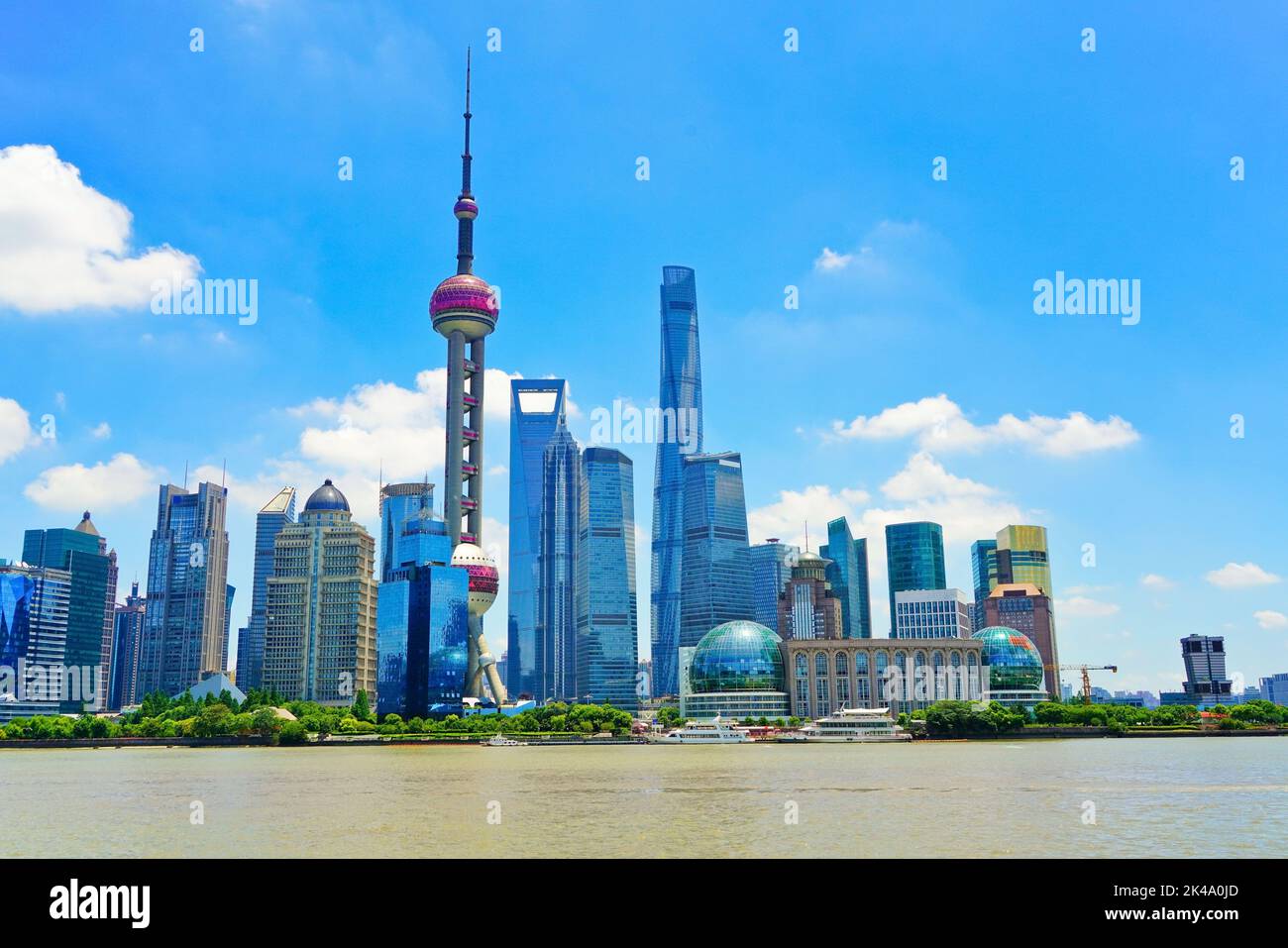 View of the skyline along the riverside on a sunny day in Shanghai ...