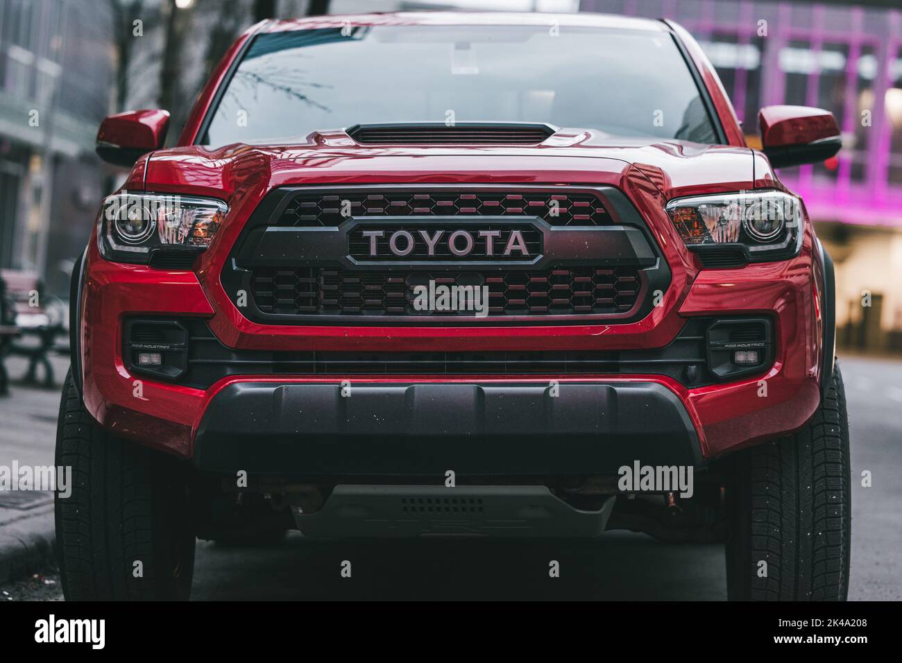 A red Toyota Tacoma parked downtown Calgary, Alberta. Stock Photo