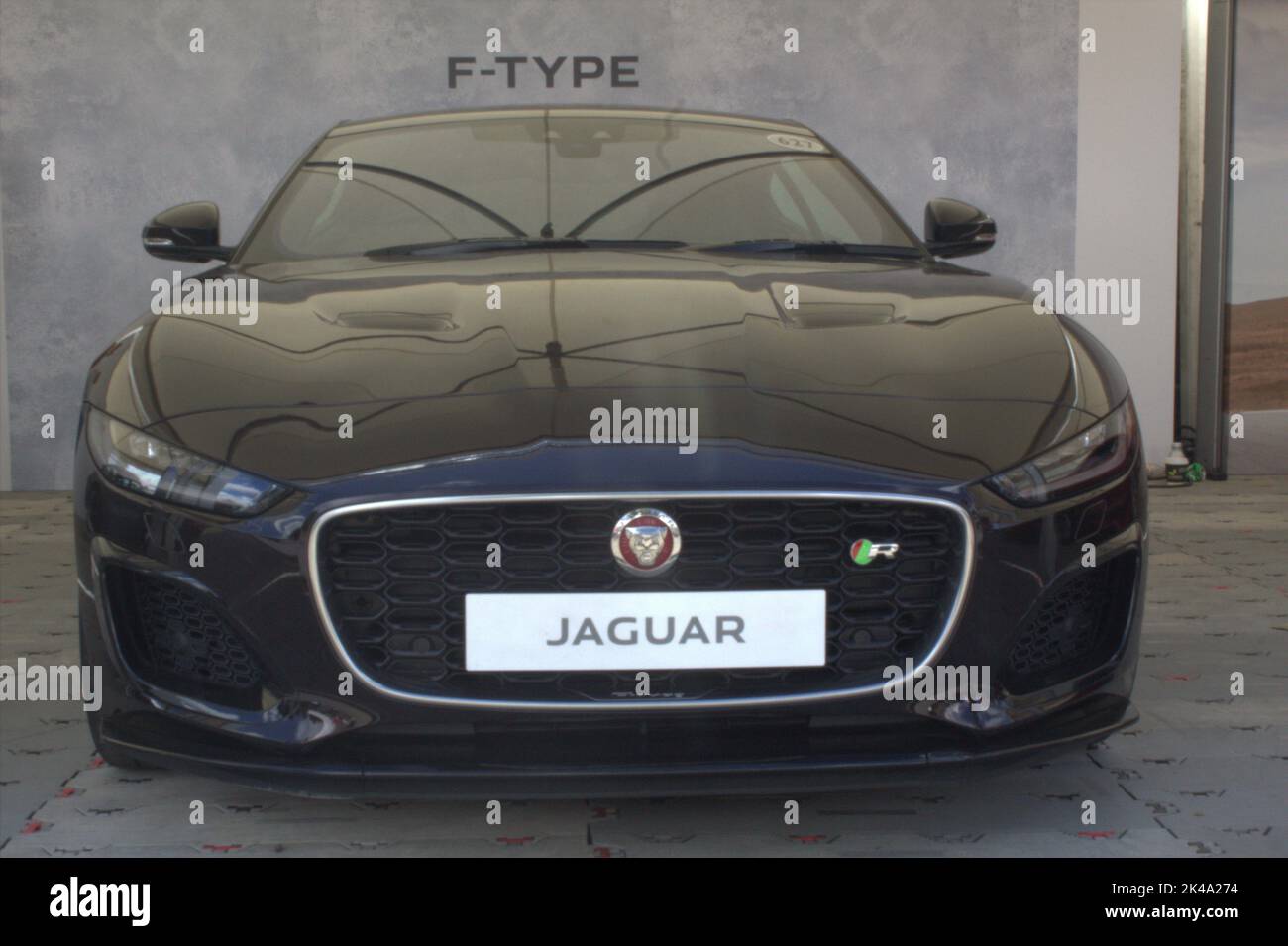 A black Jaguar car on the Goodwood motor circuit festival Stock Photo