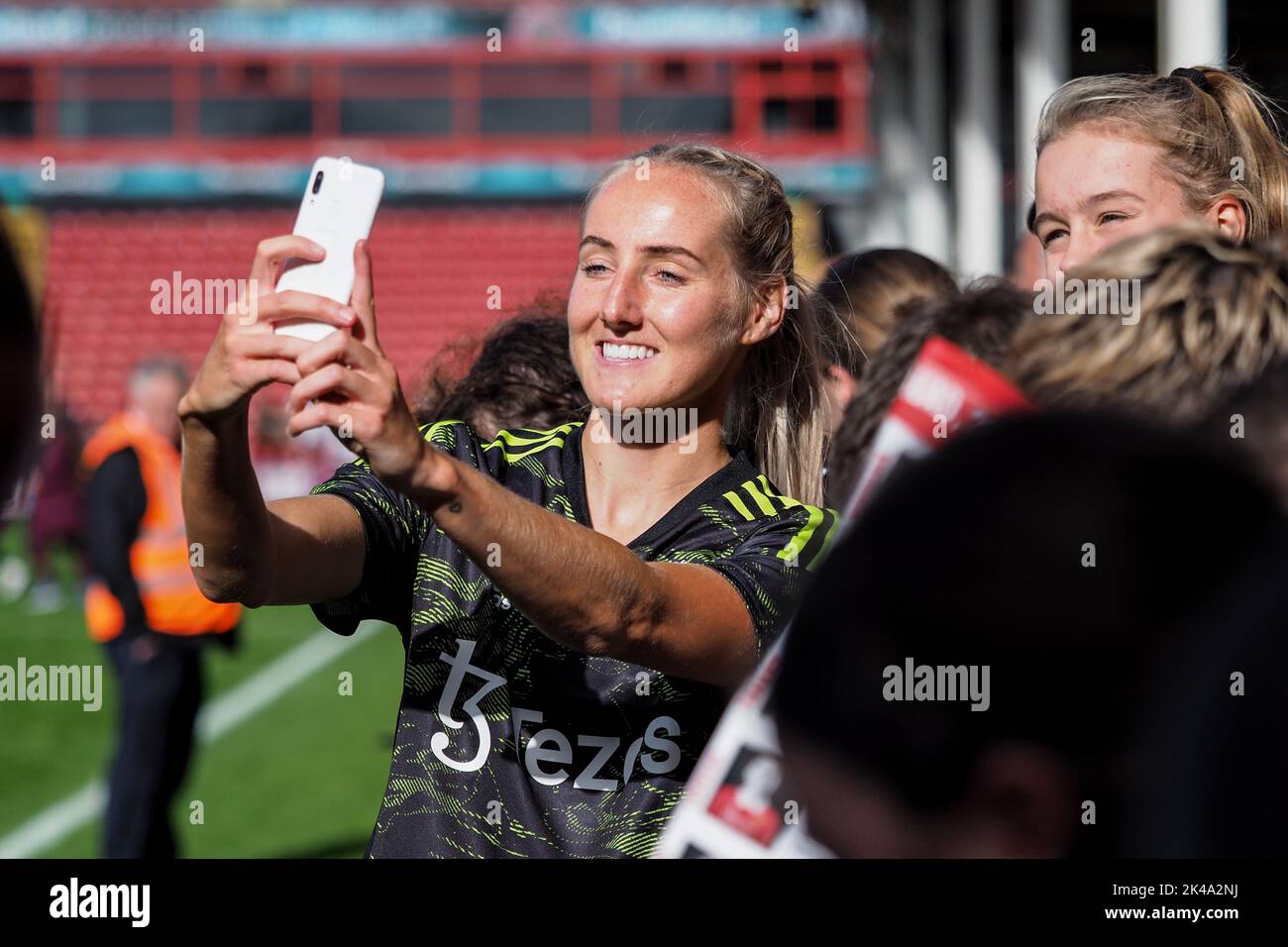 Walsall, UK. 01st Oct, 2022. Walsall, England, October 2nd 2022: Millie Turner (21 Manchester United) takes a photo with a fan during the FA Womens Continental League Cup game between Aston Villa and Manchester United at Bescot Stadium in Walsall, England (Natalie Mincher/SPP) Credit: SPP Sport Press Photo. /Alamy Live News Stock Photo