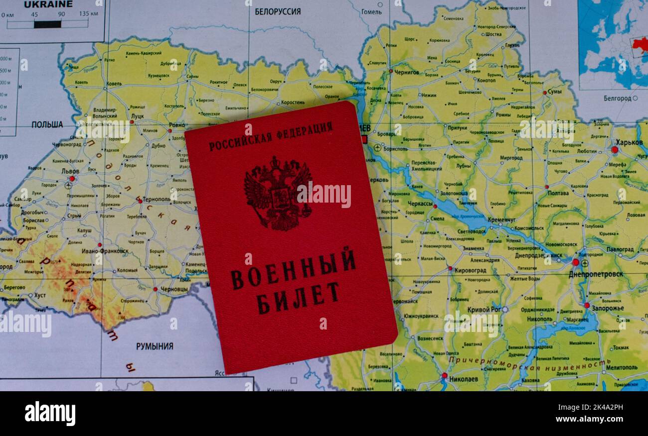 September 25, 2022, Moscow, Russia. Military ticket of a reserve serviceman of the Russian Federation on the background of a map of Ukraine Stock Photo