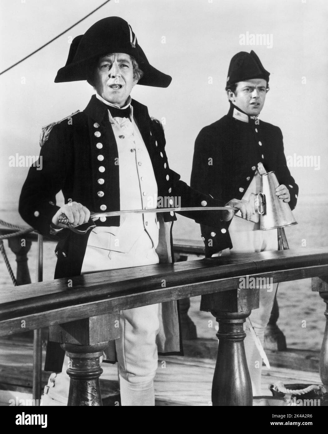 Alec Guinness (left), on-set of the British Film, 'H.M.S. Defiant', U.S. Title, 'Damn the Defiant!', Columbia Pictures, 1962 Stock Photo