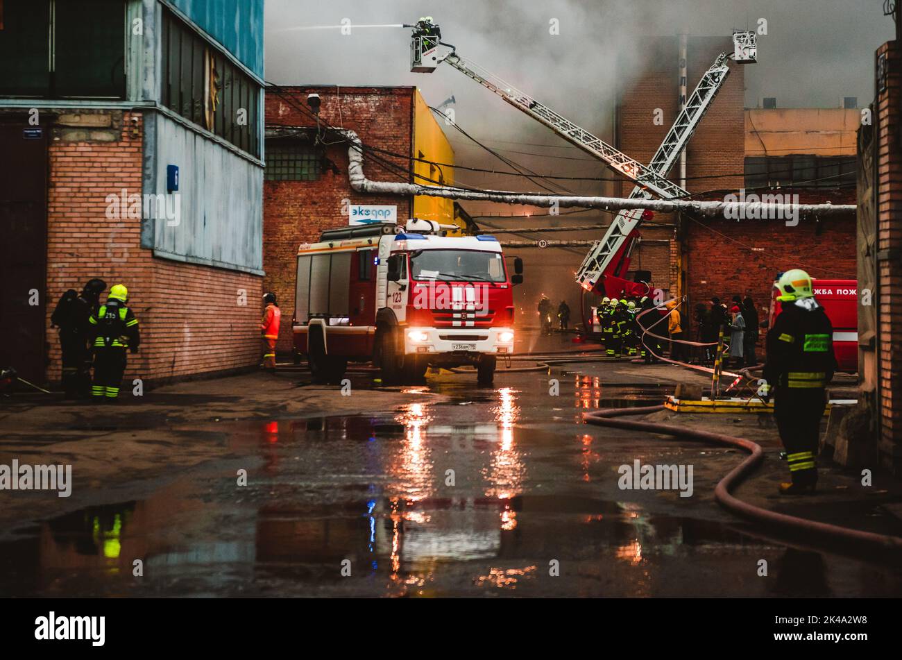 December 13, 2019, Moscow, Russia. A fire brigade extinguishes a fire in an industrial quarter. Stock Photo